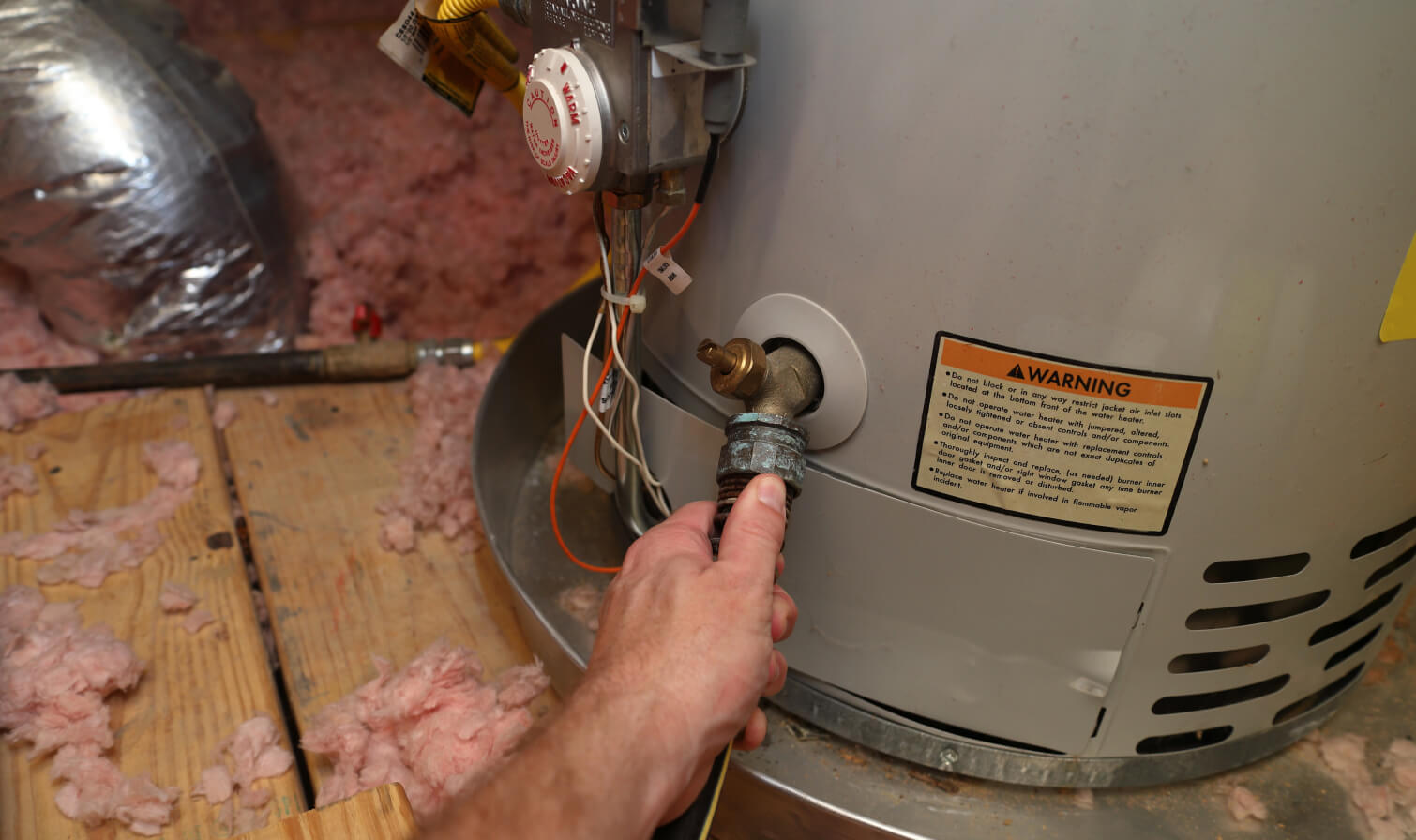 technician repairs Water Heater Tank in Burlington