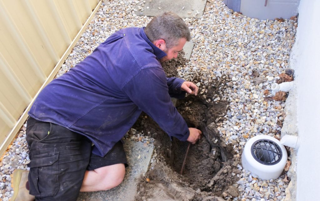 Plumber replacing pipes