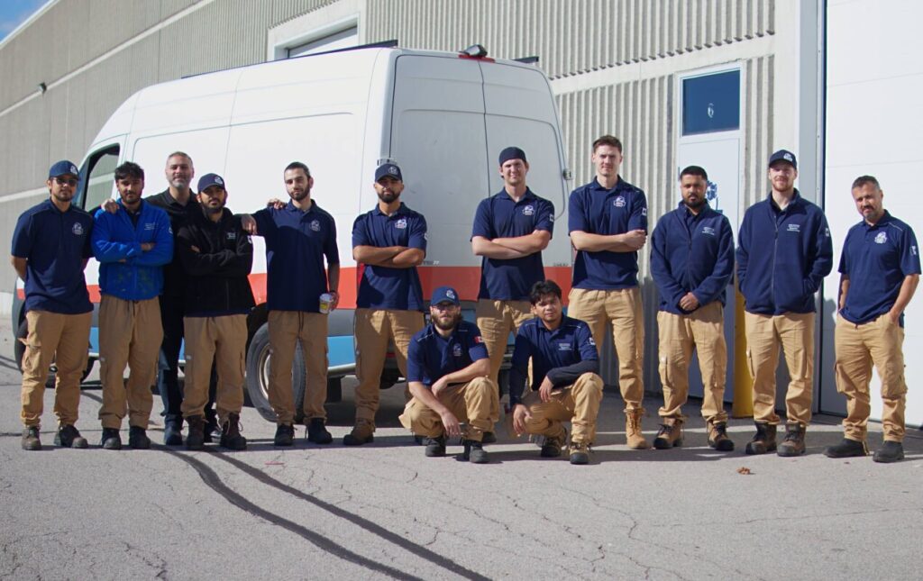 Superior Plumbing & Heating team of expert technicians standing by a van ready for Commercial plumbing service work
