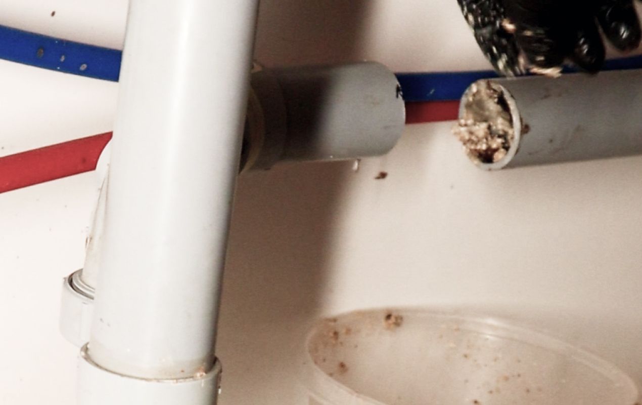 Close-up of pipe debris removed during a Drain Cleaning local service by Superior Plumbing & Heating.