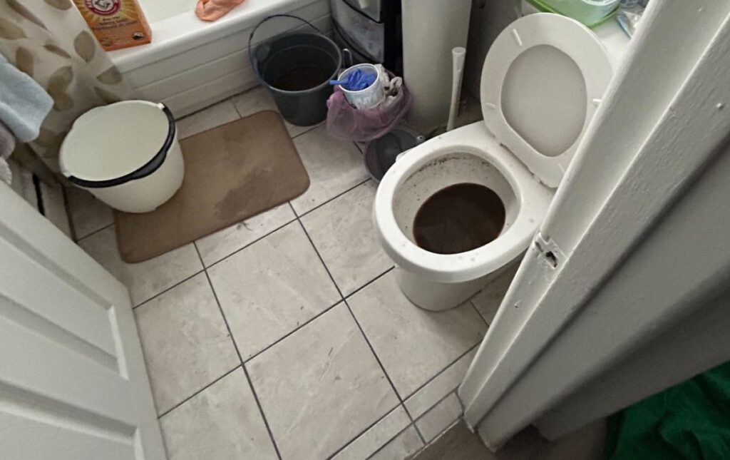 Clogged bathroom toilet before a Drain Cleaning local service by Superior Plumbing & Heating.
