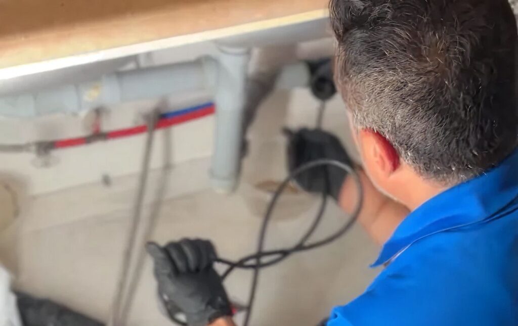 Superior Plumbing & Heating specialist using a sewer camera for a Drain Cleaning local check.