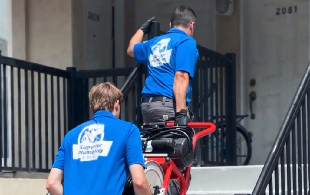 Superior Plumbing & Heating team arriving with equipment for a Drain Cleaning local project.