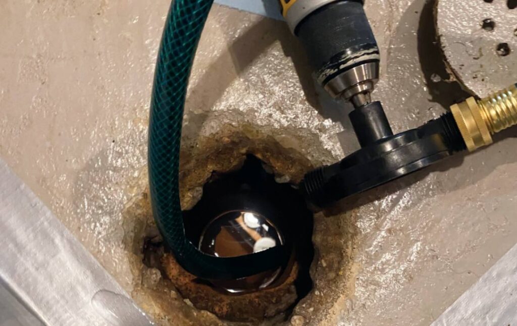 Rotary cleaning tool in action for Drain Cleaning local by Superior Plumbing & Heating.