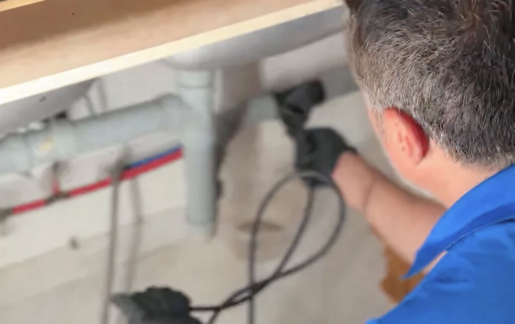 Professional Drain Cleaning local under a bathroom sink performed by Superior Plumbing & Heating.