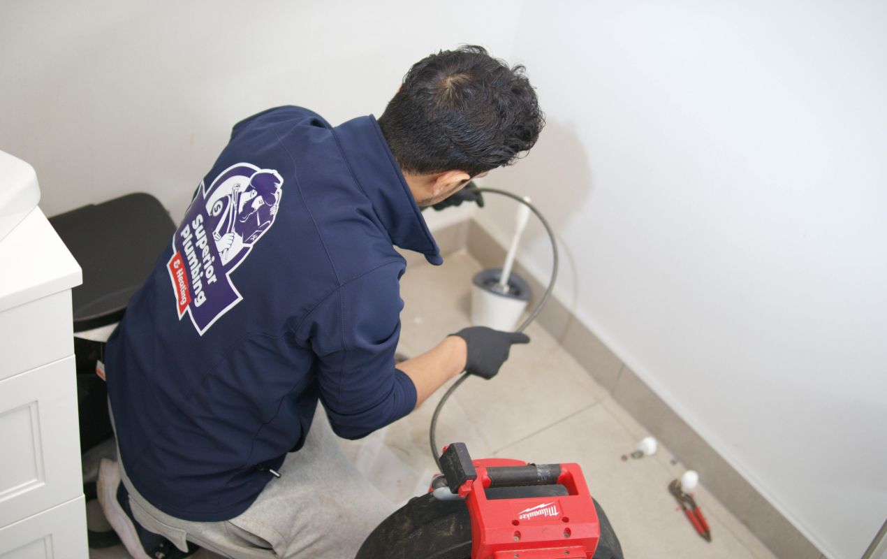Superior Plumbing & Heating expert doing Drain Cleaning local with professional equipment.