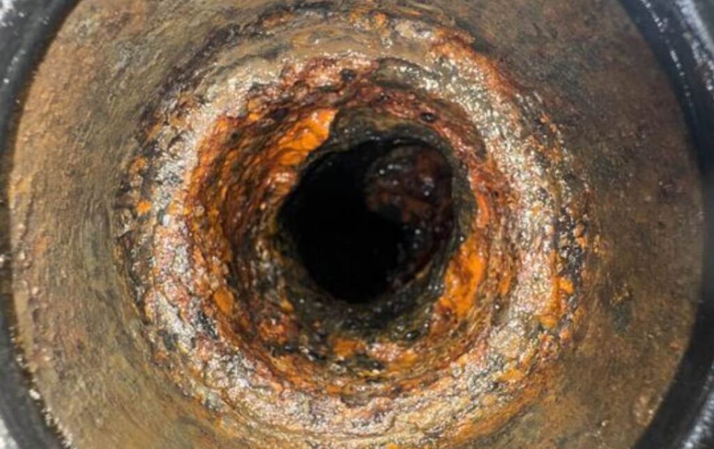 Corroded pipe interior before Drain Cleaning local by a Superior Plumbing & Heating specialist.