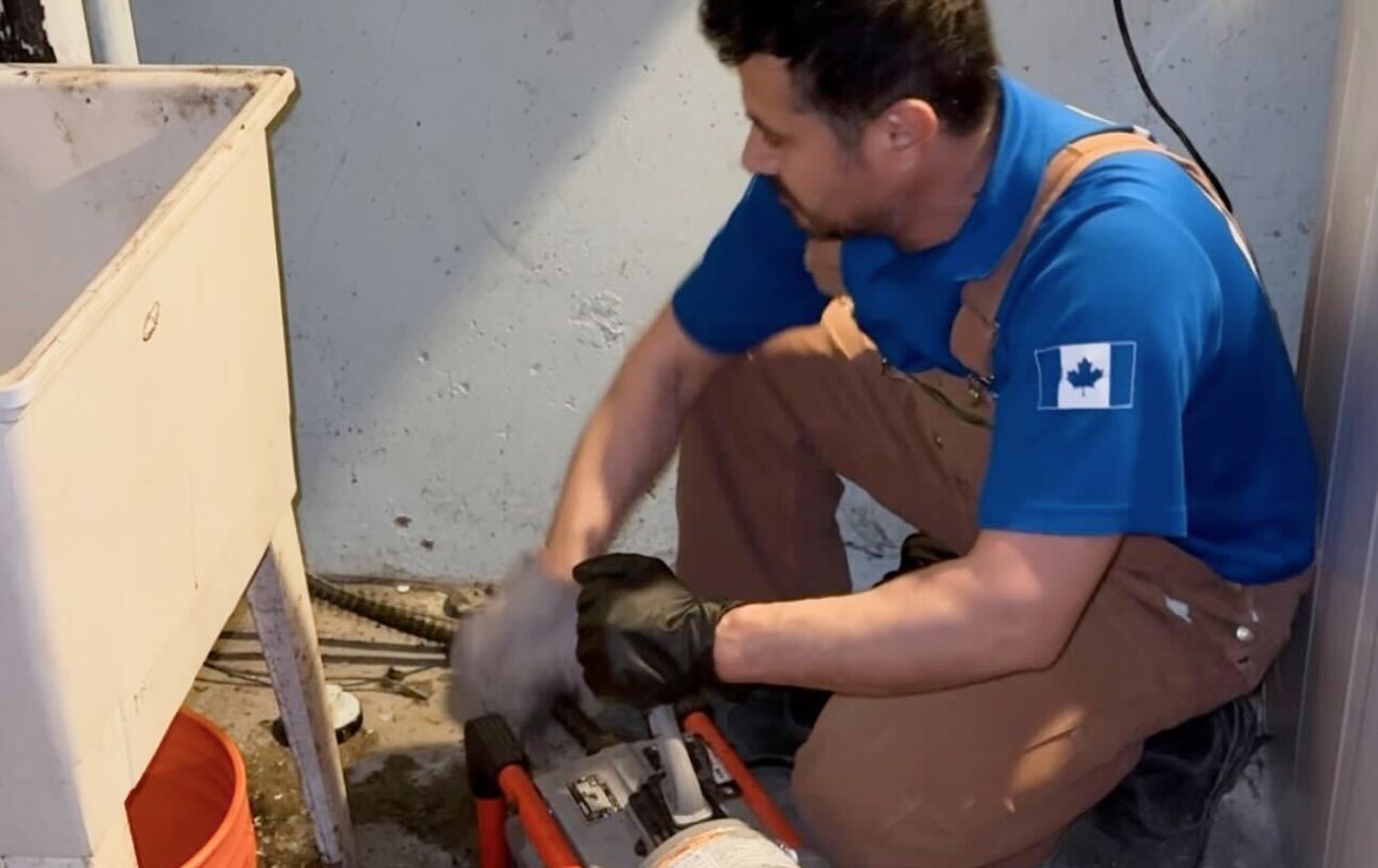 Superior Plumbing & Heating expert using a snake machine for Drain Cleaning local.