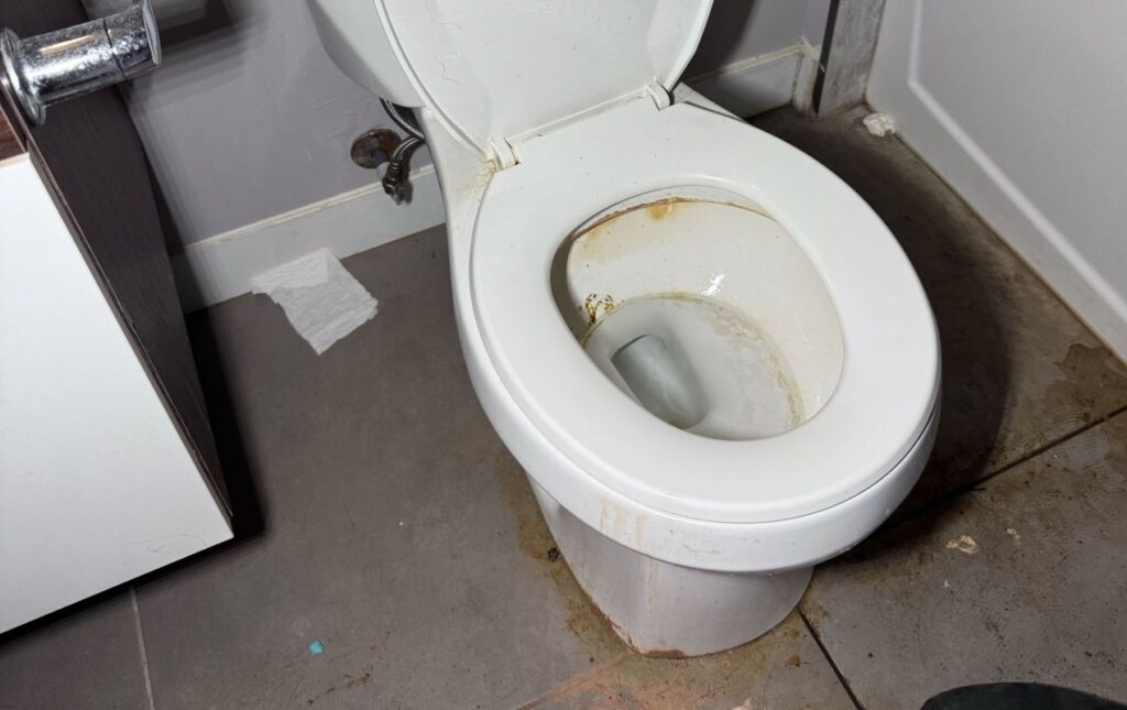 Toilet repair service by Superior Plumbing & Heating addressing toilet overflow and restoring clean, safe bathroom conditions