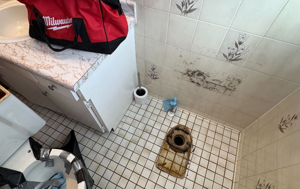 Toilet repair service by Superior Plumbing & Heating repairing a damaged toilet flange and preparing the base for proper installation