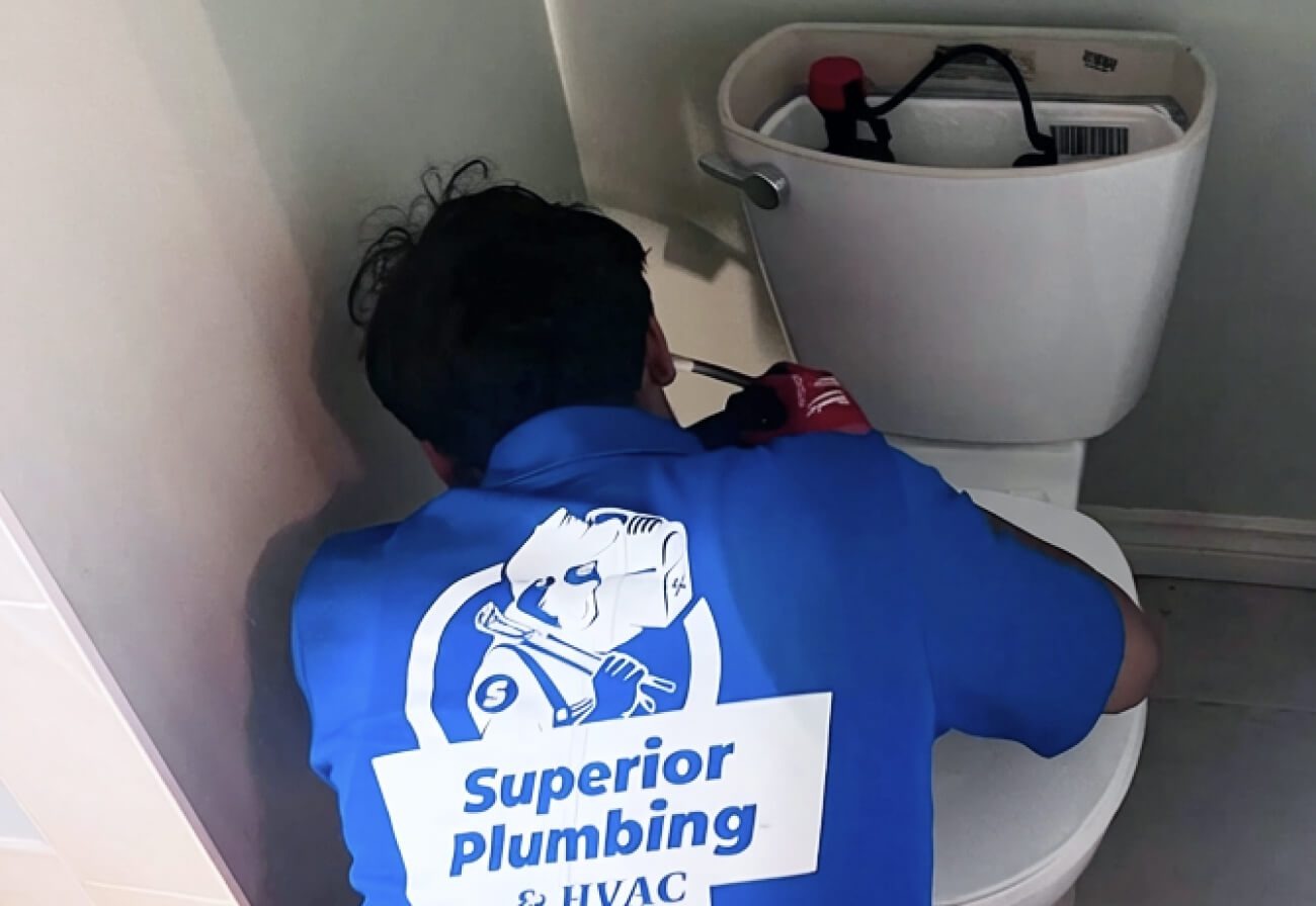 Professional toilet repair service by Superior Plumbing & Heating, resolving common toilet issues and restoring reliable operation