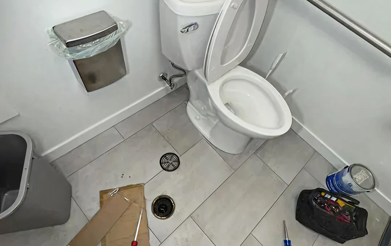 Professional toilet repair service restoring proper drainage and fixture performance in a residential bathroom by expert plumbers