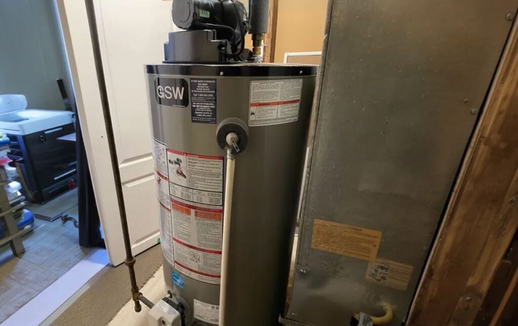 Superior Plumbing & Heating professional Water Heater Installation of a GSW gas tank unit in a residential utility room