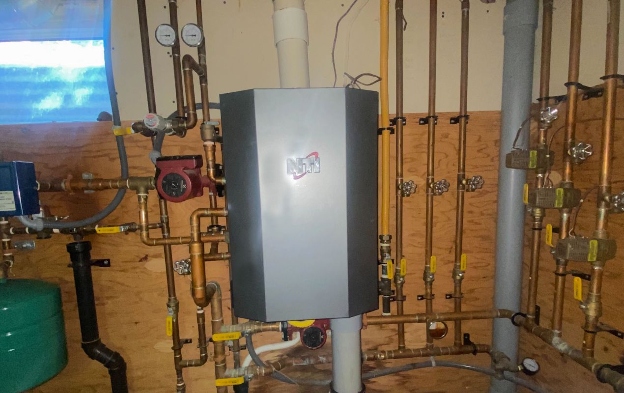 Superior Plumbing & Heating professional Water Heater Installation of an NTI tankless boiler with copper piping