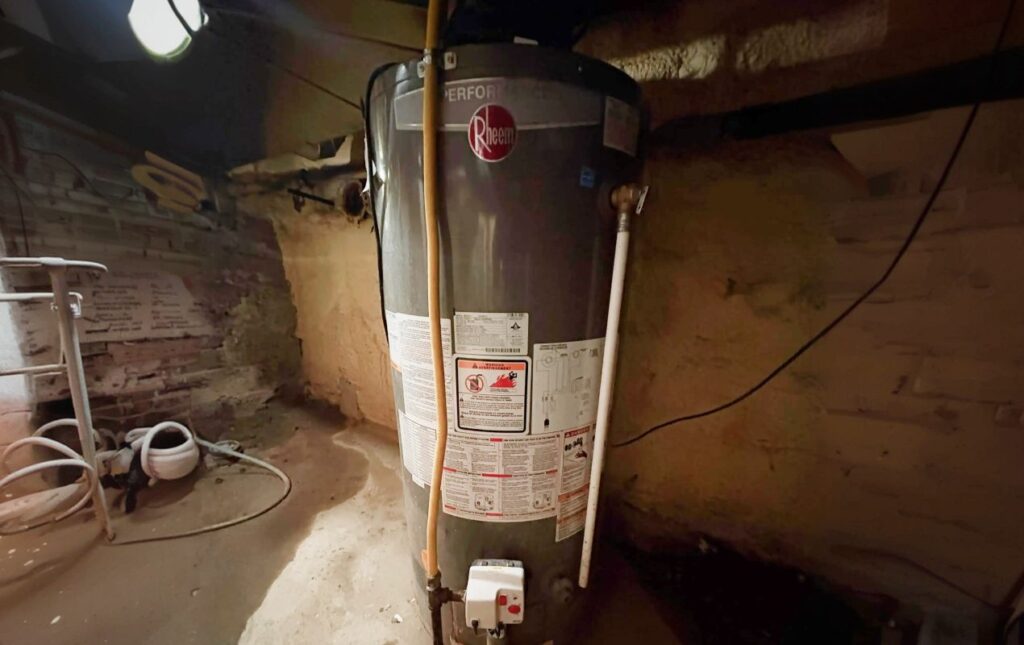 Superior Plumbing & Heating professional Water Heater Installation of a Rheem gas tank in a home basement setting