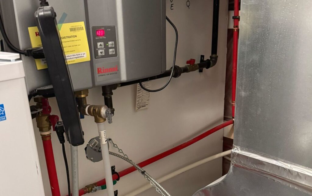 Superior Plumbing & Heating professional Water Heater Installation of a Rinnai tankless unit in a mechanical room