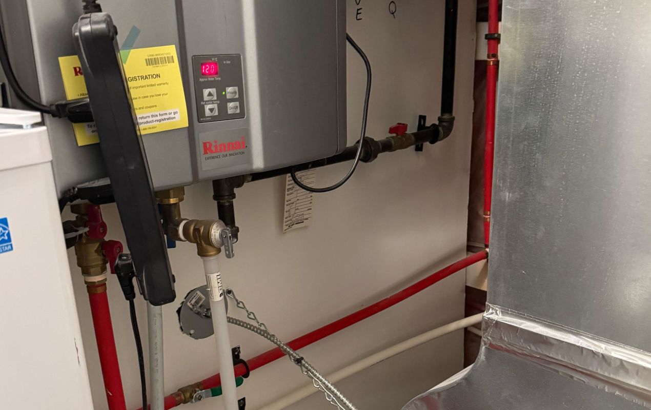 Superior Plumbing & Heating professional Water Heater Installation of a Rinnai tankless unit in a mechanical room