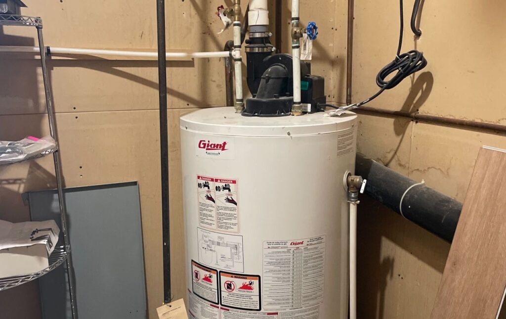 Superior Plumbing & Heating professional Water Heater Installation of a Giant tank unit in a residential utility room