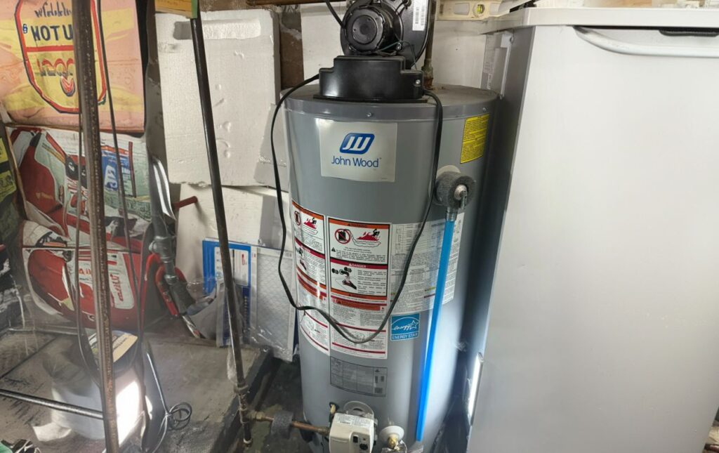 Superior Plumbing & Heating professional Water Heater Installation of a wall mounted tankless unit in a utility room