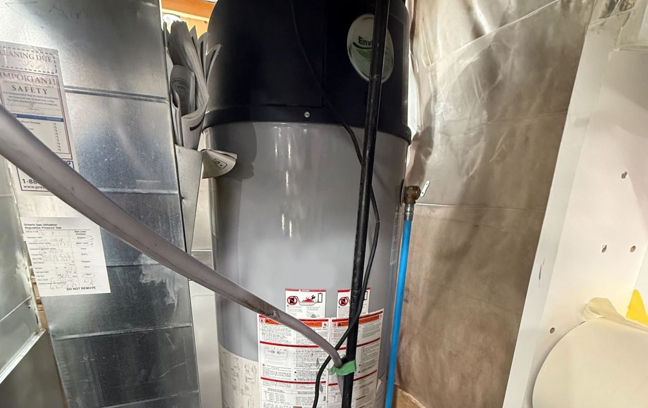 Superior Plumbing & Heating professional Water Heater Installation of a high efficiency tank unit in a residential basement