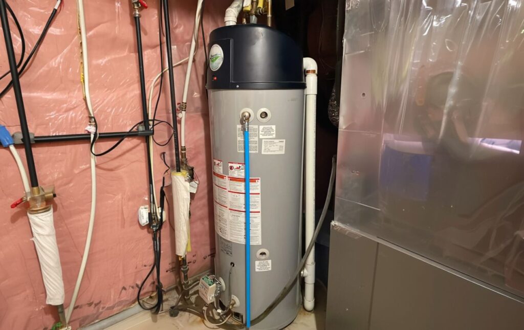 Superior Plumbing & Heating expert Water Heater Installation of a tall white tank unit in a residential closet