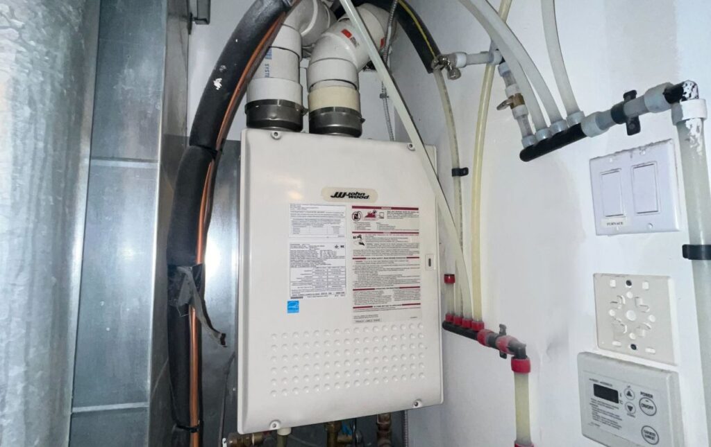 Superior Plumbing & Heating expert Water Heater Installation of a John Wood gas tank in a residential basement