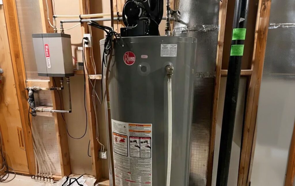 Superior Plumbing & Heating expert Water Heater Installation of a Rheem grey gas tank in an unfinished basement