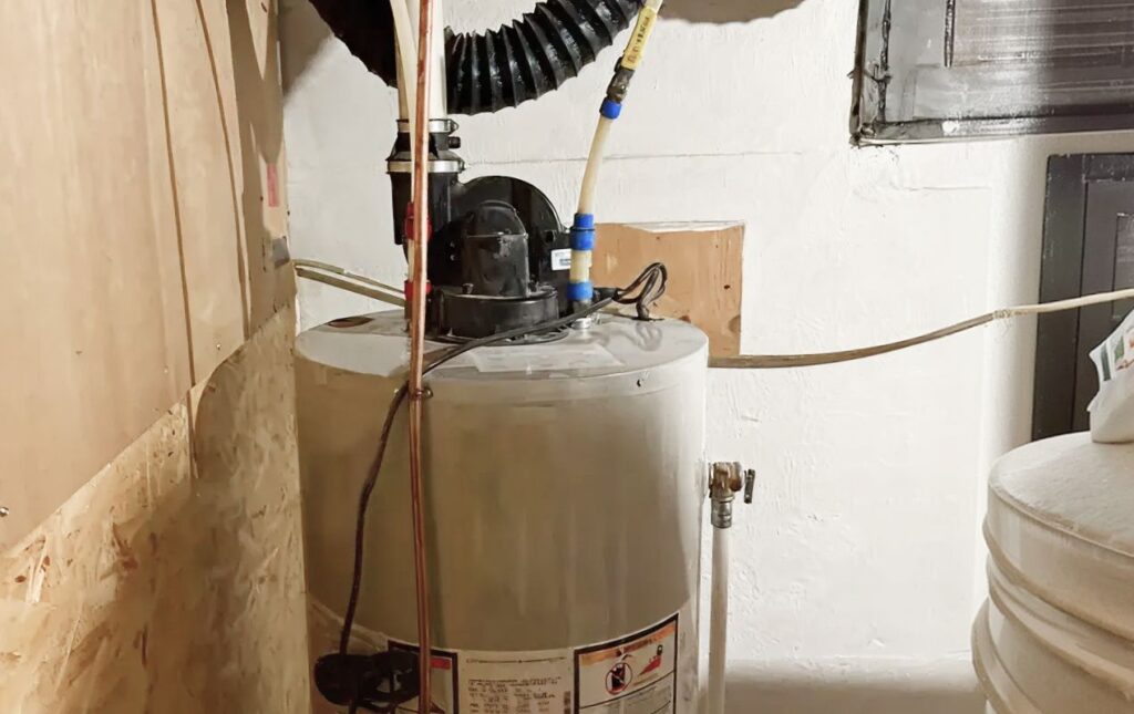 Superior Plumbing & Heating professional Water Heater Installation of a gas tank unit in a residential basement room