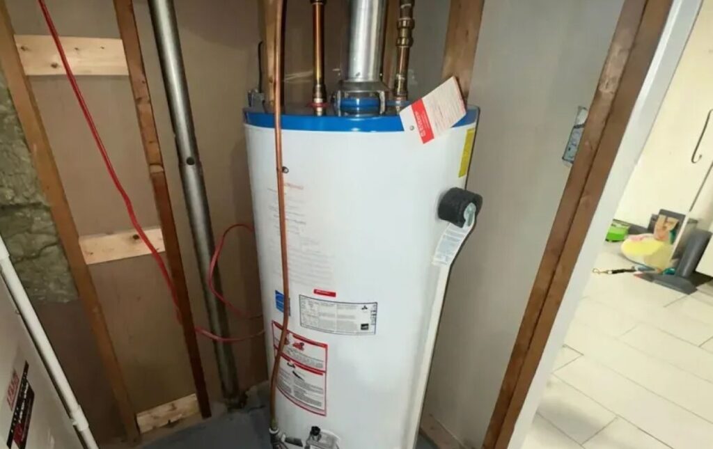 Superior Plumbing & Heating expert completing water heater installation with updated venting, shutoff valves, and pressure relief system