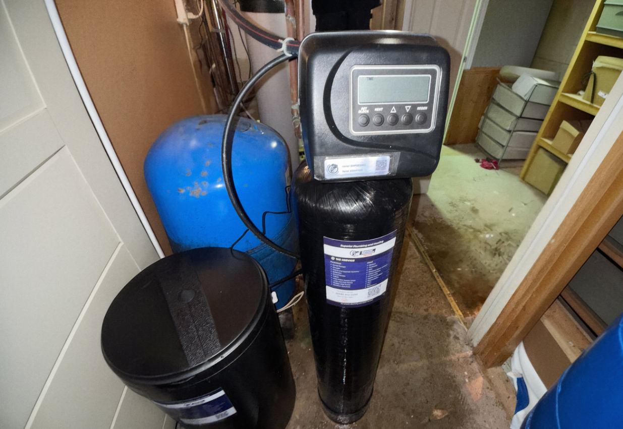 Superior Plumbing & Heating expert Water Softener Replacement of a black media tank system with a blue pressure tank