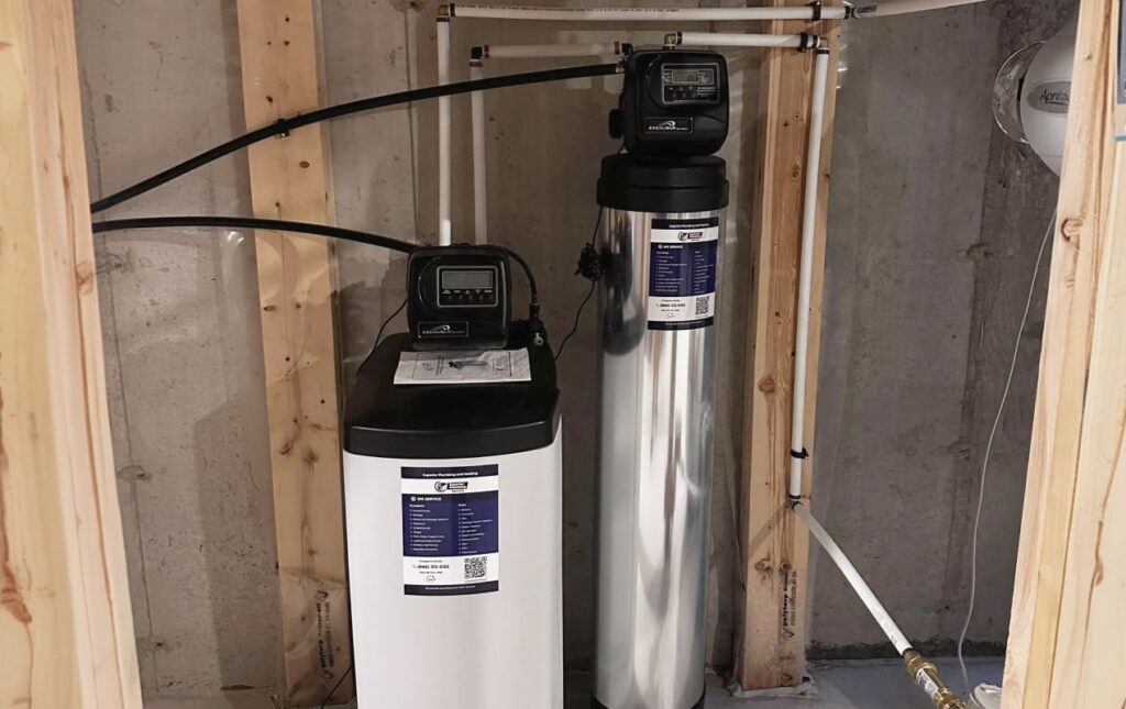 Superior Plumbing & Heating expert Water Softener Replacement of a two-tank system including a white brine tank and stainless steel resin tank