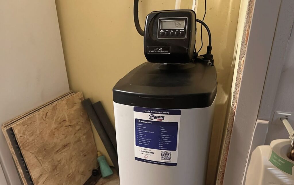Superior Plumbing & Heating expert Water Softener Installation of a modern grey cabinet-style system in a utility room