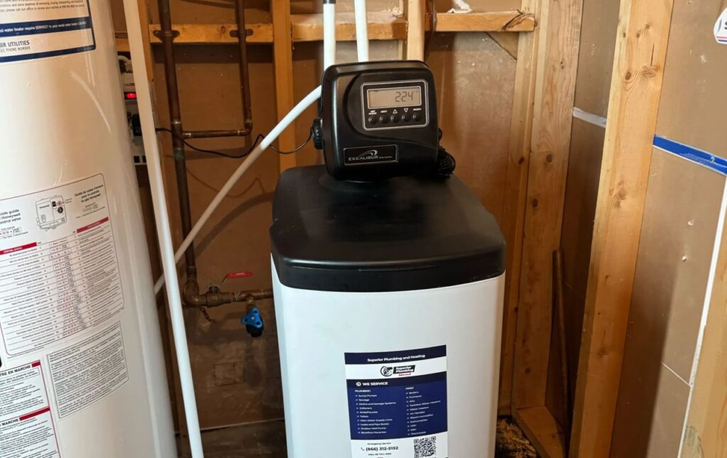 Superior Plumbing & Heating expert Water Softener Installation of a high-efficiency grey cabinet unit in an unfinished basement