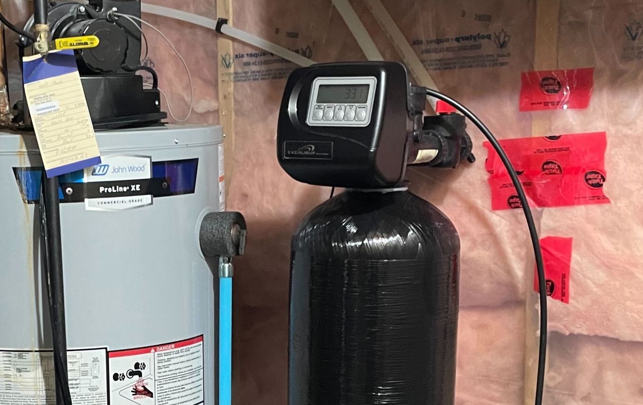 Superior Plumbing & Heating expert Water Softener Repair featuring a black resin tank with a digital control head