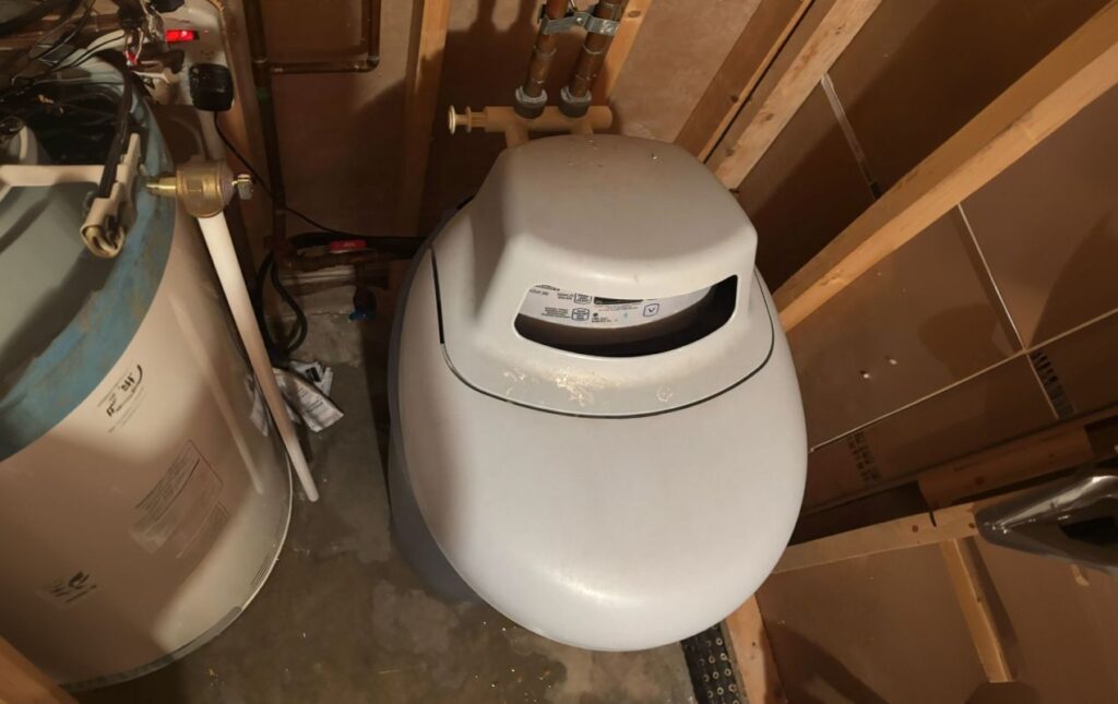 Superior Plumbing & Heating expert Water Softener Repair of a light grey cabinet-style water softening system