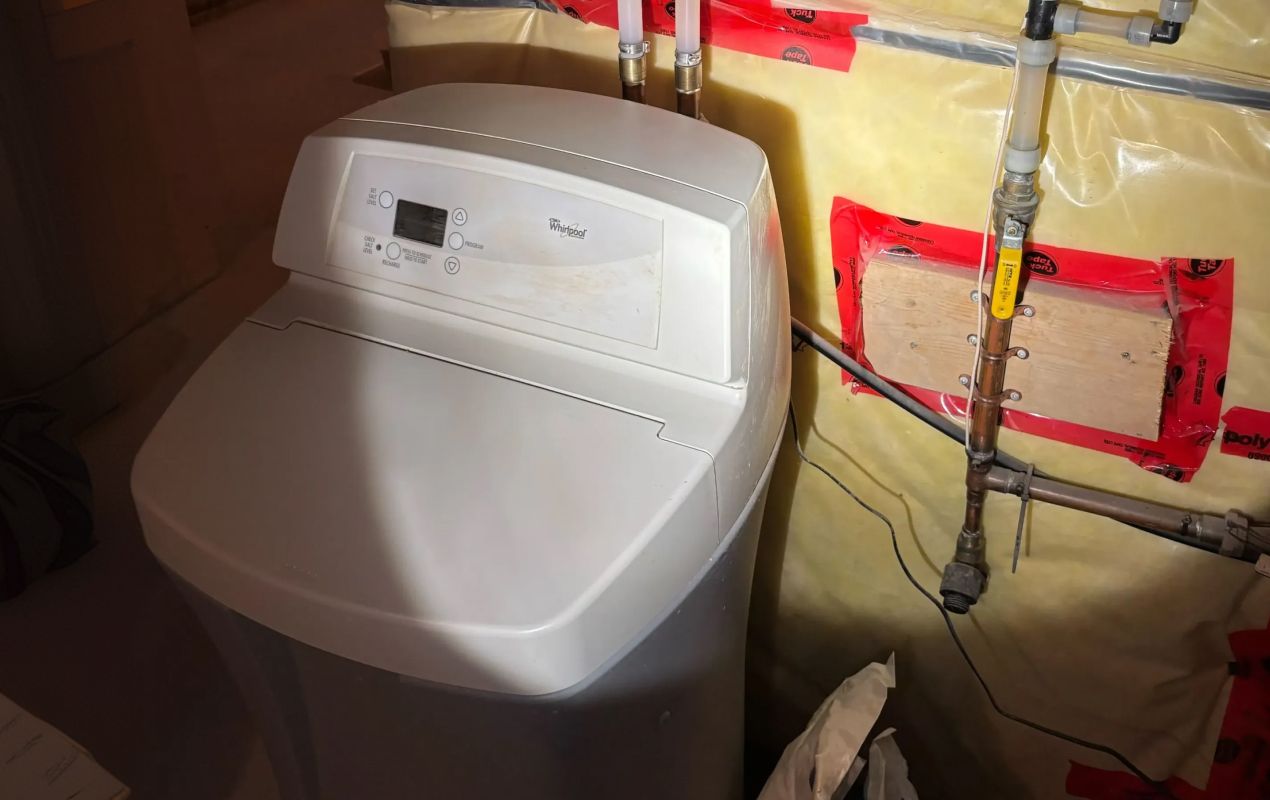 Superior Plumbing & Heating expert Water Softener Repair of a white residential cabinet-style water softening unit