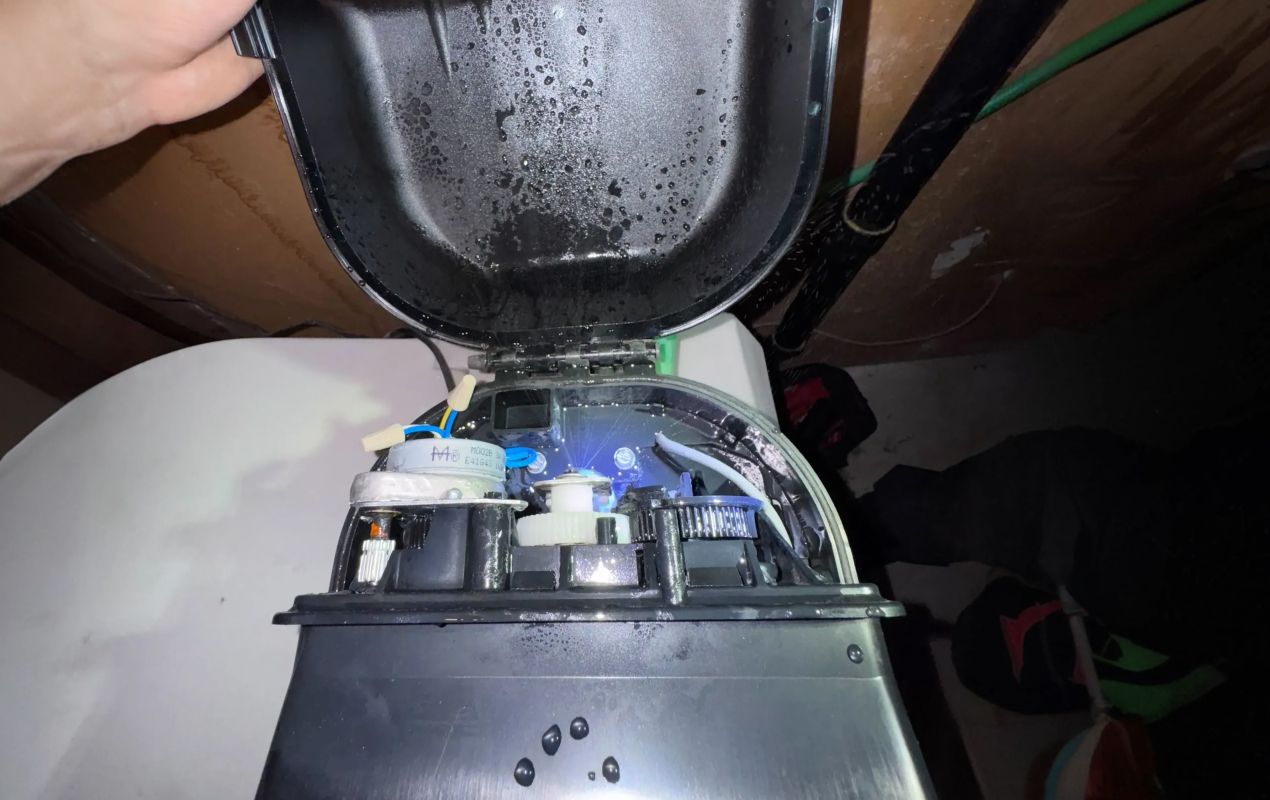 Superior Plumbing & Heating expert Water Softener Repair of an open control head showing internal mechanical gears