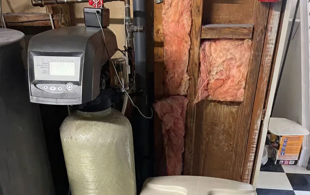 Superior Plumbing & Heating expert Water Softener Repair of a tan resin tank with a digital control valve