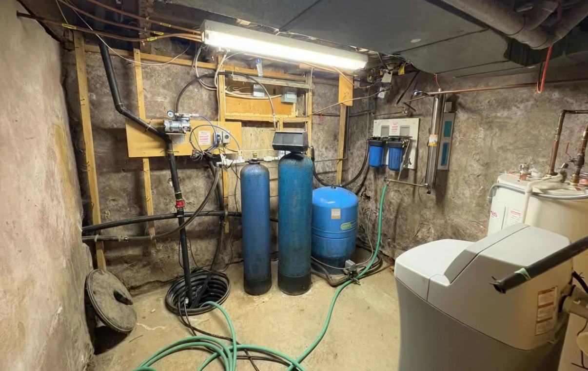 Superior Plumbing & Heating expert Water Softener Repair of a complex multi-tank filtration system in a basement
