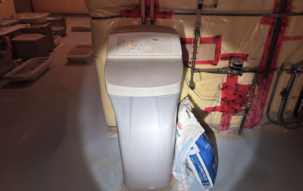 Superior Plumbing & Heating expert Water Softener Repair of a Whirlpool cabinet unit in an unfinished basement