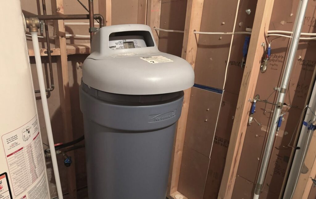 Superior Plumbing & Heating expert Water Softener Repair of a Kenmore grey cabinet unit in a utility room