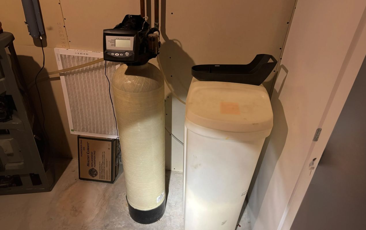 Superior Plumbing & Heating expert Water Softener Repair of a tan resin tank and white square brine tank system