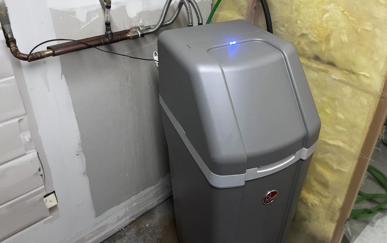 Superior Plumbing & Heating expert Water Softener Installation-replacement of a tan resin tank with a black Fleck control valve