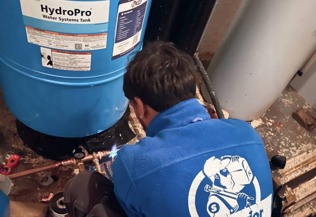 Pipe soldering for well pump replacement local by Superior Plumbing & Heating technician.