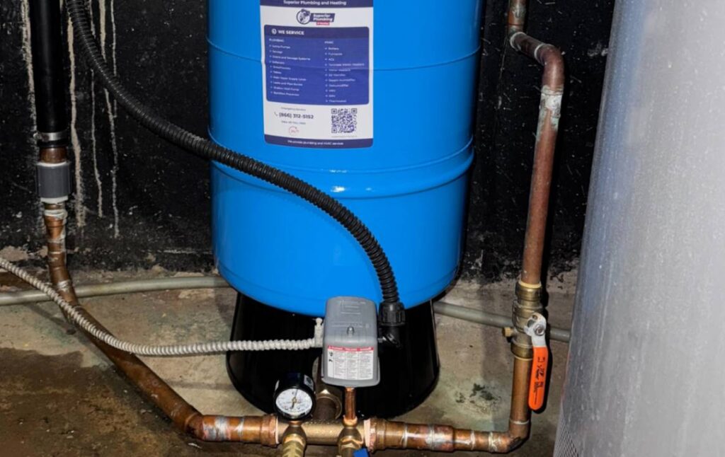 Final configuration of the pressure switch and copper manifold for a well pump installation local by Superior Plumbing & Heating