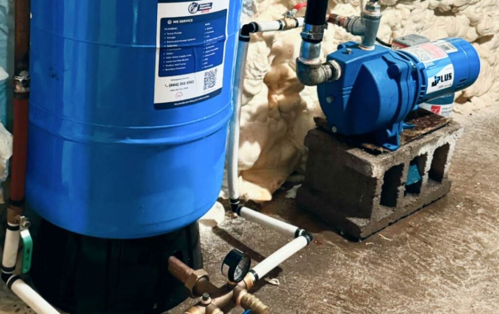 Side view of the tank and pump assembly during a well pump installation local by Superior Plumbing & Heating