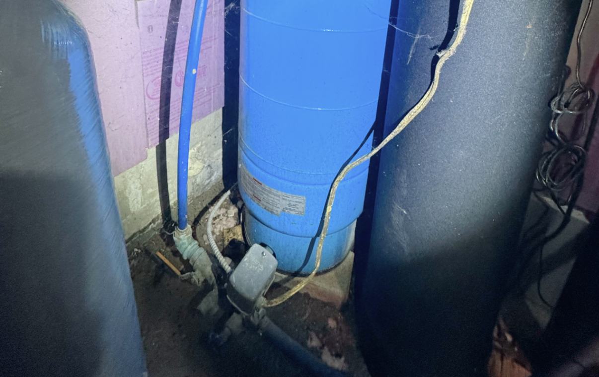 Blue tank piping for well pump replacement local by Superior Plumbing & Heating.