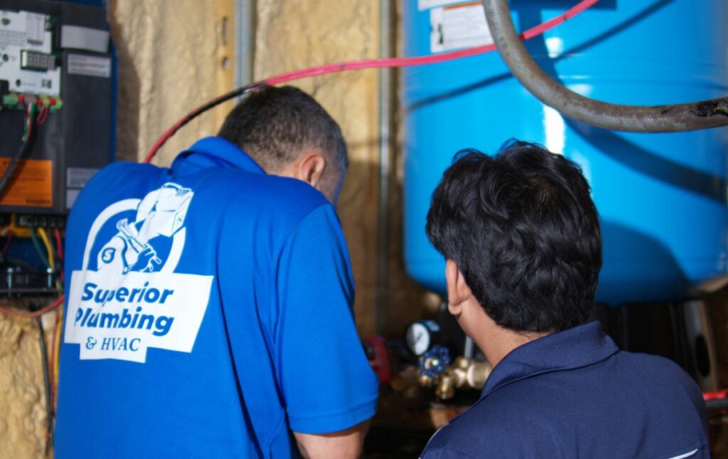 Team inspecting the system for Well pump repair local by Superior Plumbing & Heating.