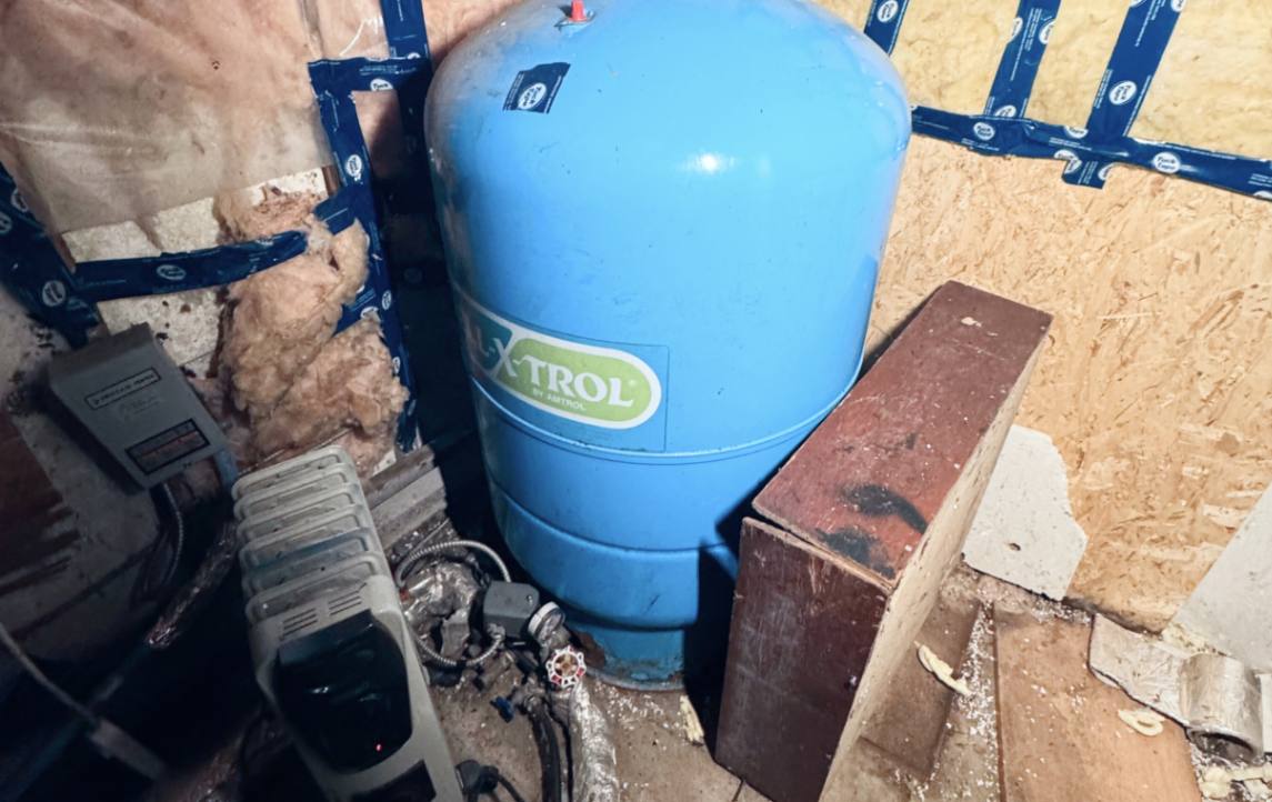 Blue Amtrol tank inspection for Well pump repair local by Superior Plumbing & Heating.