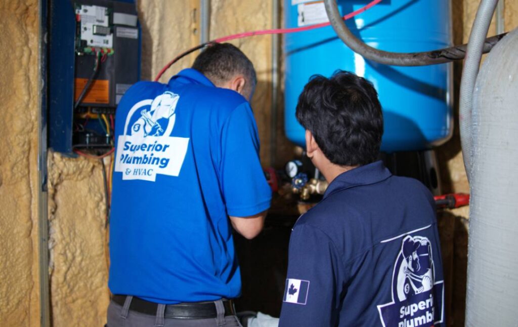 Professional team doing Well pump repair local by Superior Plumbing & Heating.